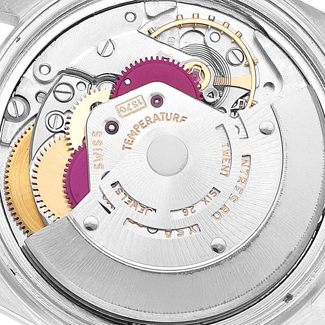 The image shows a close-up of the internal mechanical movement of the Vintage Collection Rolex watch.