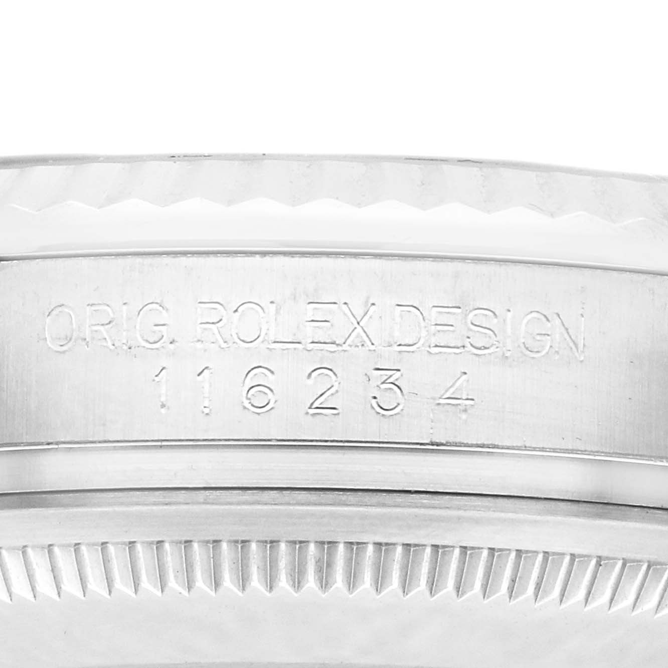 The image shows a close-up of a Rolex Datejust 116234 Men
s Stainless Steel White Dial 116234 Men
s Stainless Steel White Dial
s case side, with the "ORIG. ROLEX DESIGN" engraving and model number 116234.