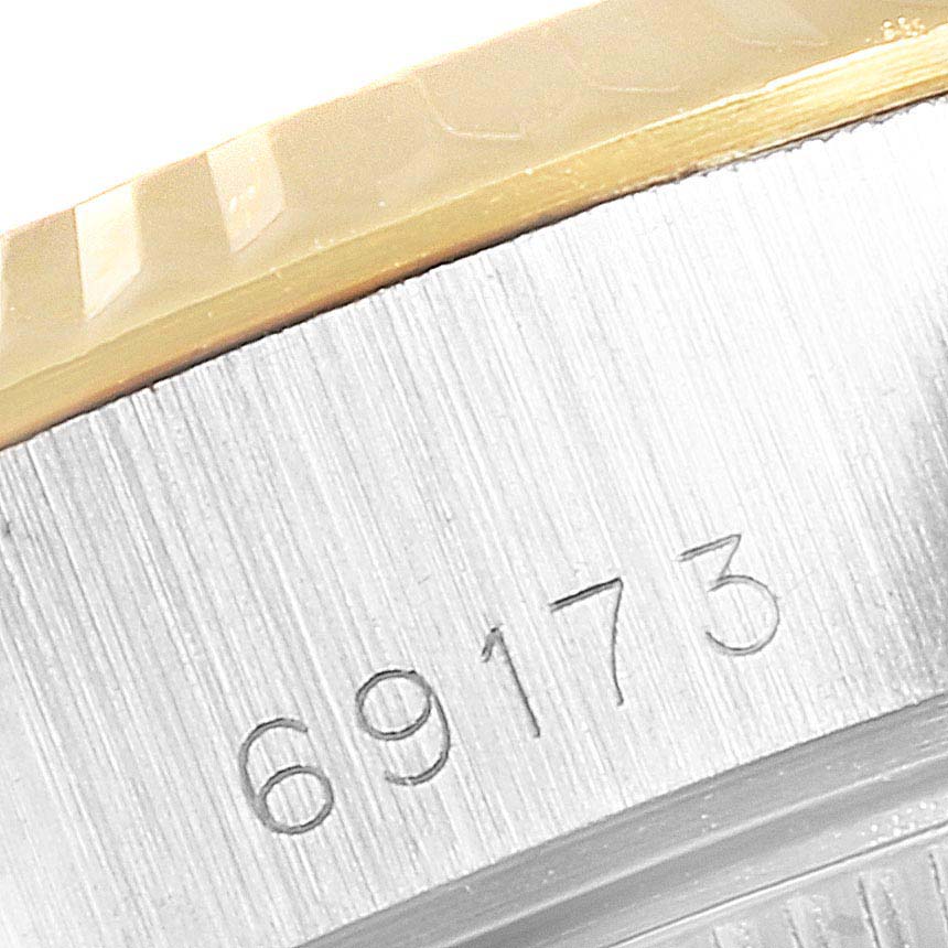 This image shows a close-up of the model number engraving (69173) on the casing of a Rolex Datejust 69173 Women's Steel and Gold (two tone) Blue Dial 69173 Women's Steel and Gold (two tone) Blue Dial watch.