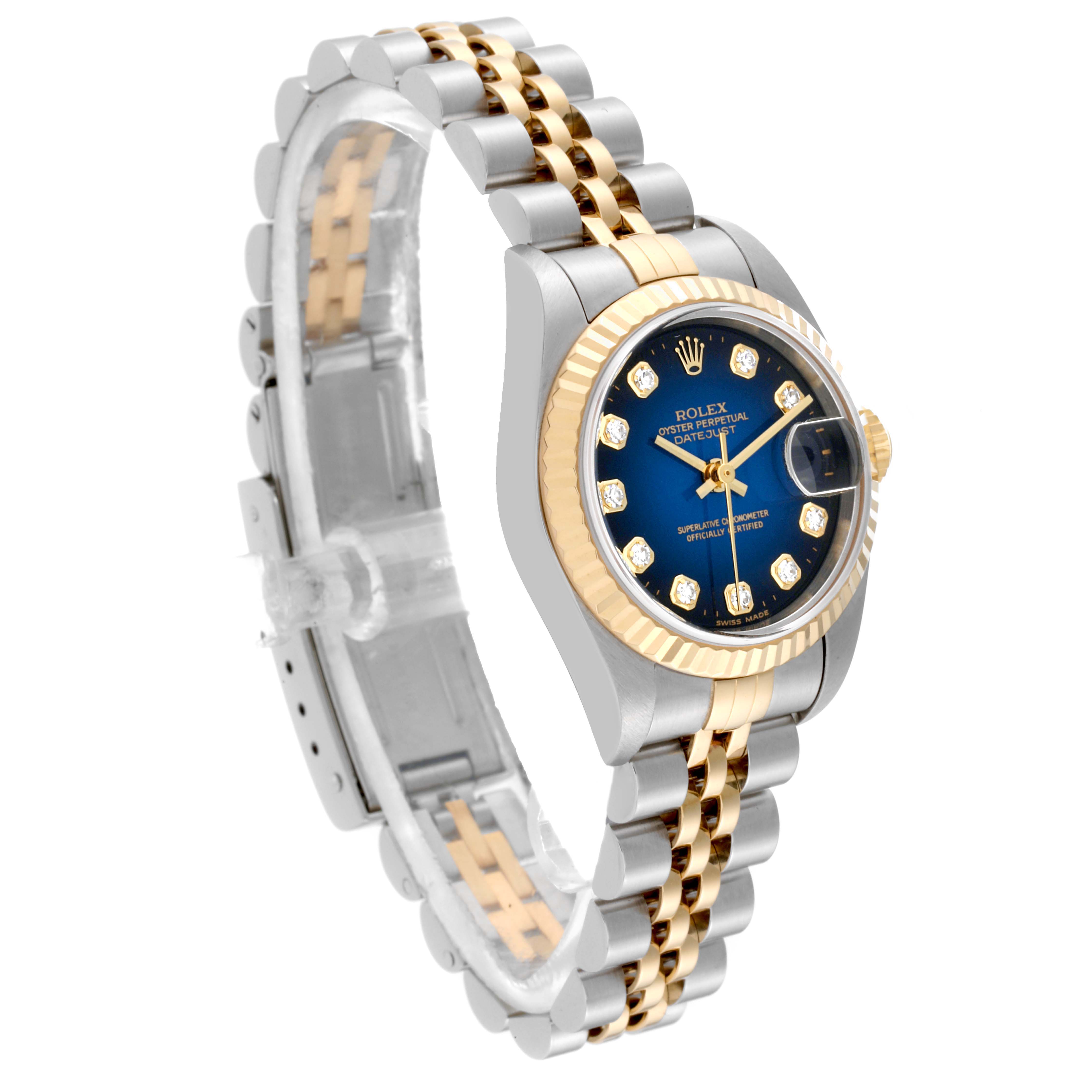 The image shows a Rolex Datejust 79173 Women's Steel and Gold (two tone) Blue Dial 79173 Women's Steel and Gold (two tone) Blue Dial watch at a three-quarter angle, highlighting the two-tone bracelet, blue dial, and diamond hour markers.