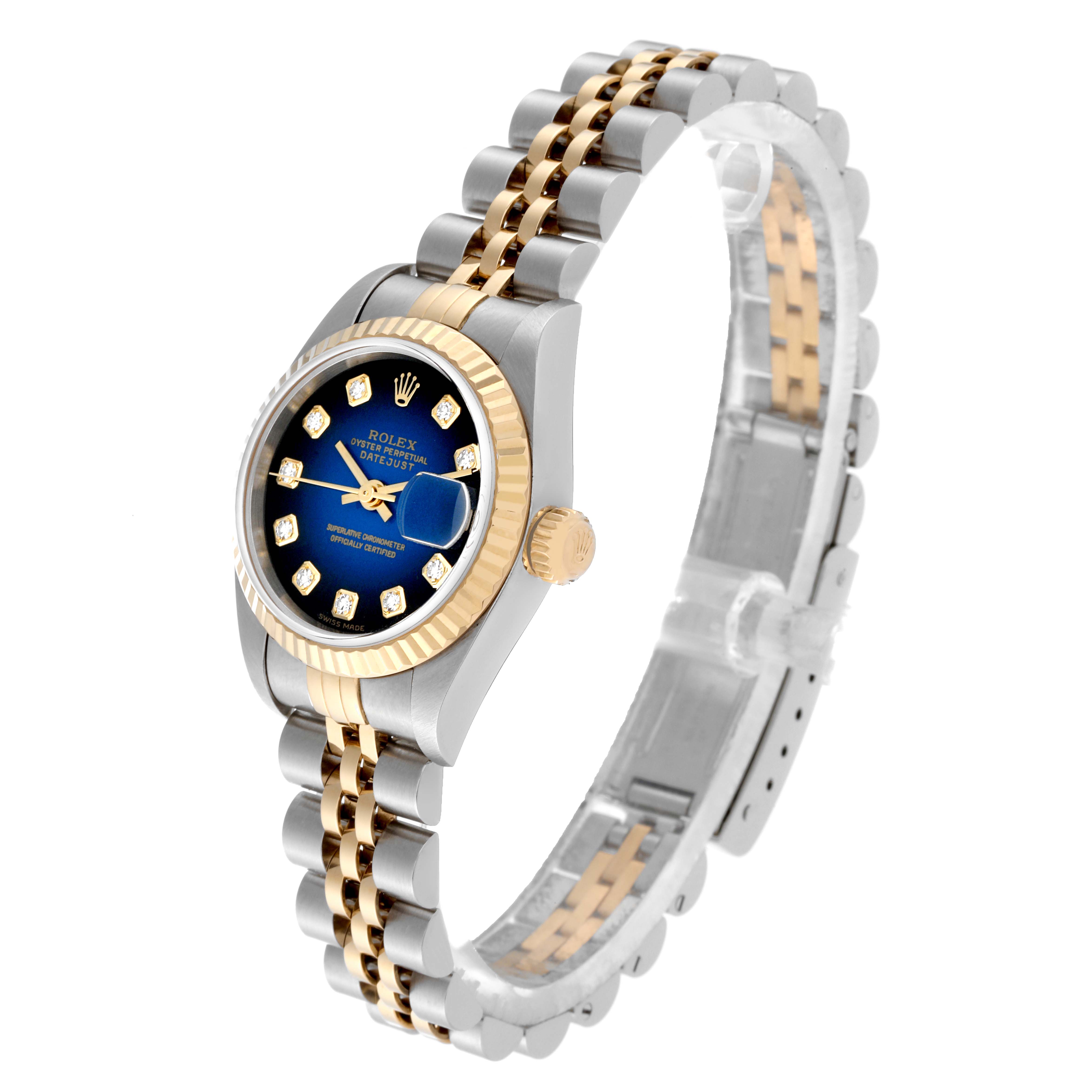The Rolex Datejust 79173 Women's Steel and Gold (two tone) Blue Dial 79173 Women's Steel and Gold (two tone) Blue Dial watch is shown from an angled side view, highlighting the face, bezel, crown, and bracelet.