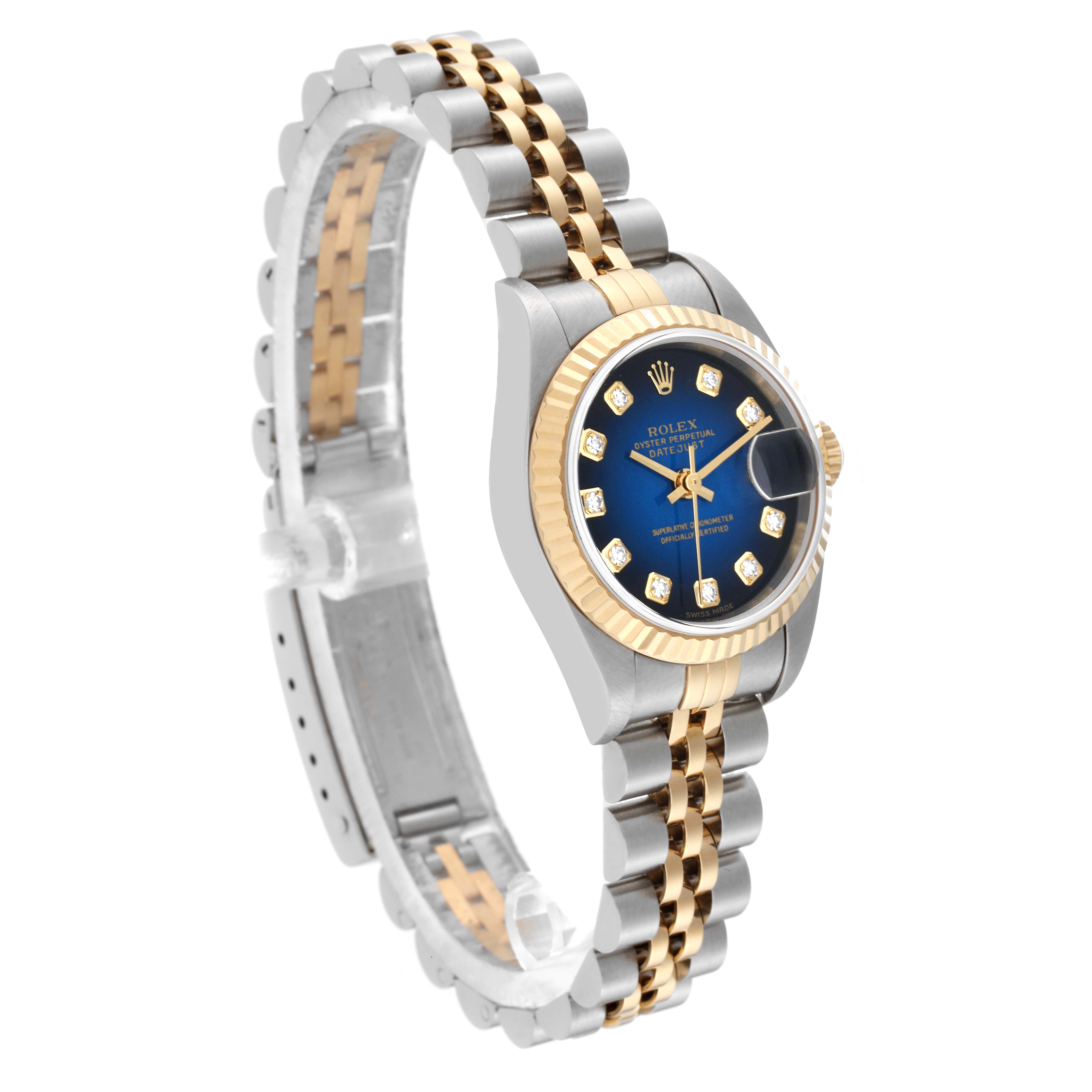 The image shows a side angle view of the Rolex Datejust 79173 Women's Steel and Gold (two tone) Blue Dial 79173 Women's Steel and Gold (two tone) Blue Dial watch, highlighting its blue dial, gold bezel, and two-tone bracelet.