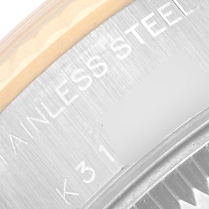 The image shows a close-up of the side and bezel of a Rolex Datejust 79173 Women's Steel and Gold (two tone) Blue Dial 79173 Women's Steel and Gold (two tone) Blue Dial watch, highlighting the "STAINLESS STEEL" text.