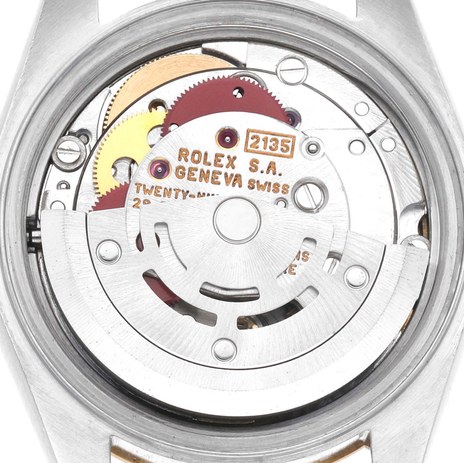 The image shows the interior movement of a Rolex Datejust 69173 Women
s Steel and Gold (two tone) Champagne Dial 69173 Women
s Steel and Gold (two tone) Champagne Dial watch from a back view, revealing gears and the rotor.