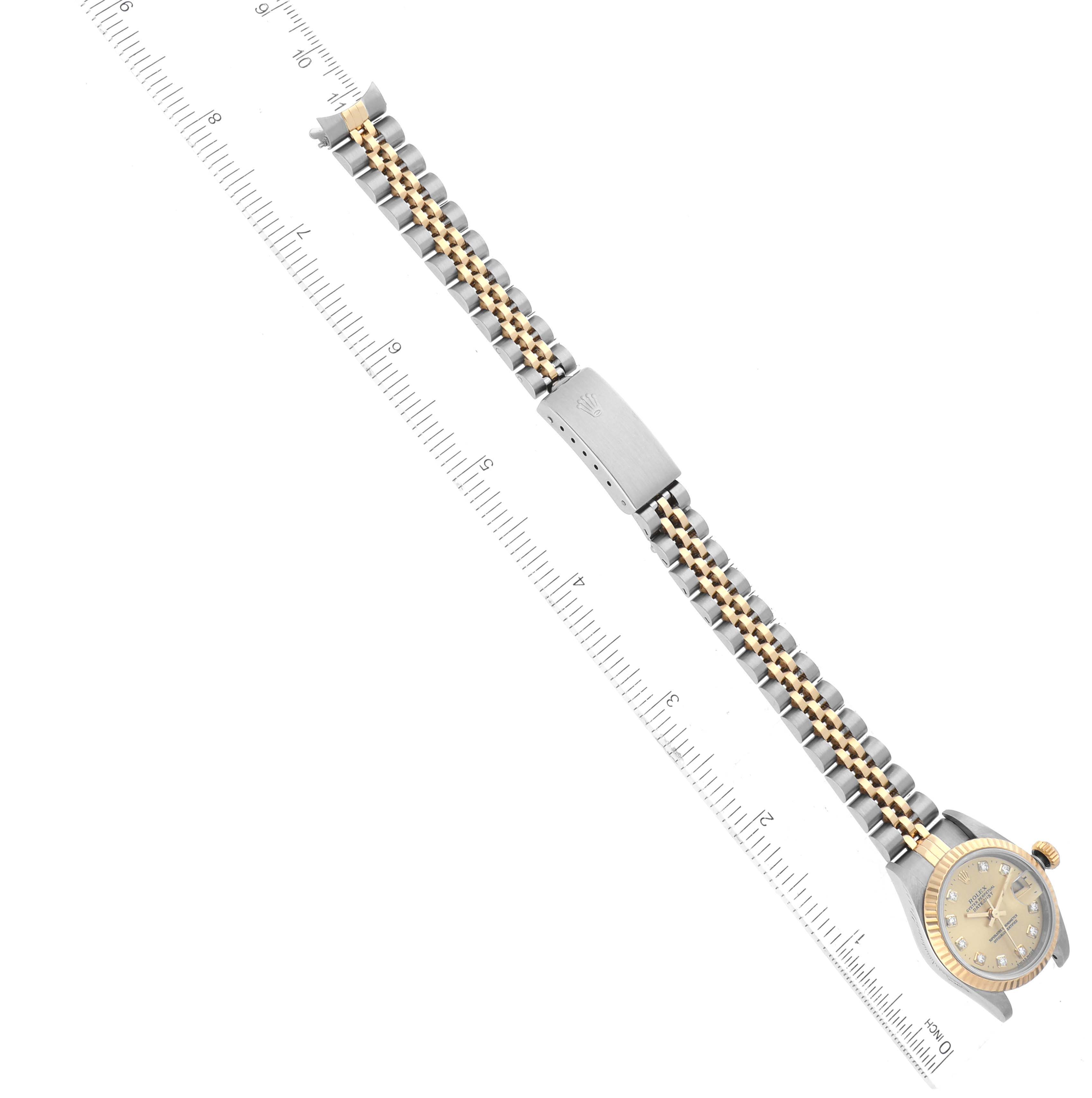 The Rolex Datejust 69173 Women's Steel and Gold (two tone) Champagne Dial 69173 Women's Steel and Gold (two tone) Champagne Dial watch is shown at a top-down angle, including the face, bracelet, and clasp.