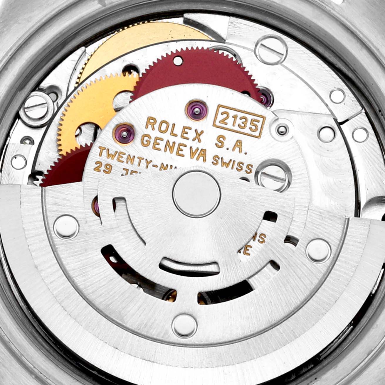 This image shows a close-up view of the internal mechanism of a Rolex Datejust 69173 Women's Steel and Gold (two tone) Champagne Dial 69173 Women's Steel and Gold (two tone) Champagne Dial watch, highlighting its gears and inscriptions.