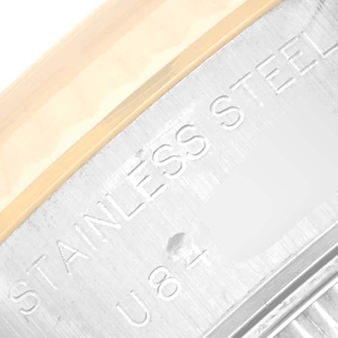 The image shows a close-up of the casing of a Rolex Datejust 69173 Women's Steel and Gold (two tone) Champagne Dial 69173 Women's Steel and Gold (two tone) Champagne Dial watch, highlighting the STAINLESS STEEL marking.