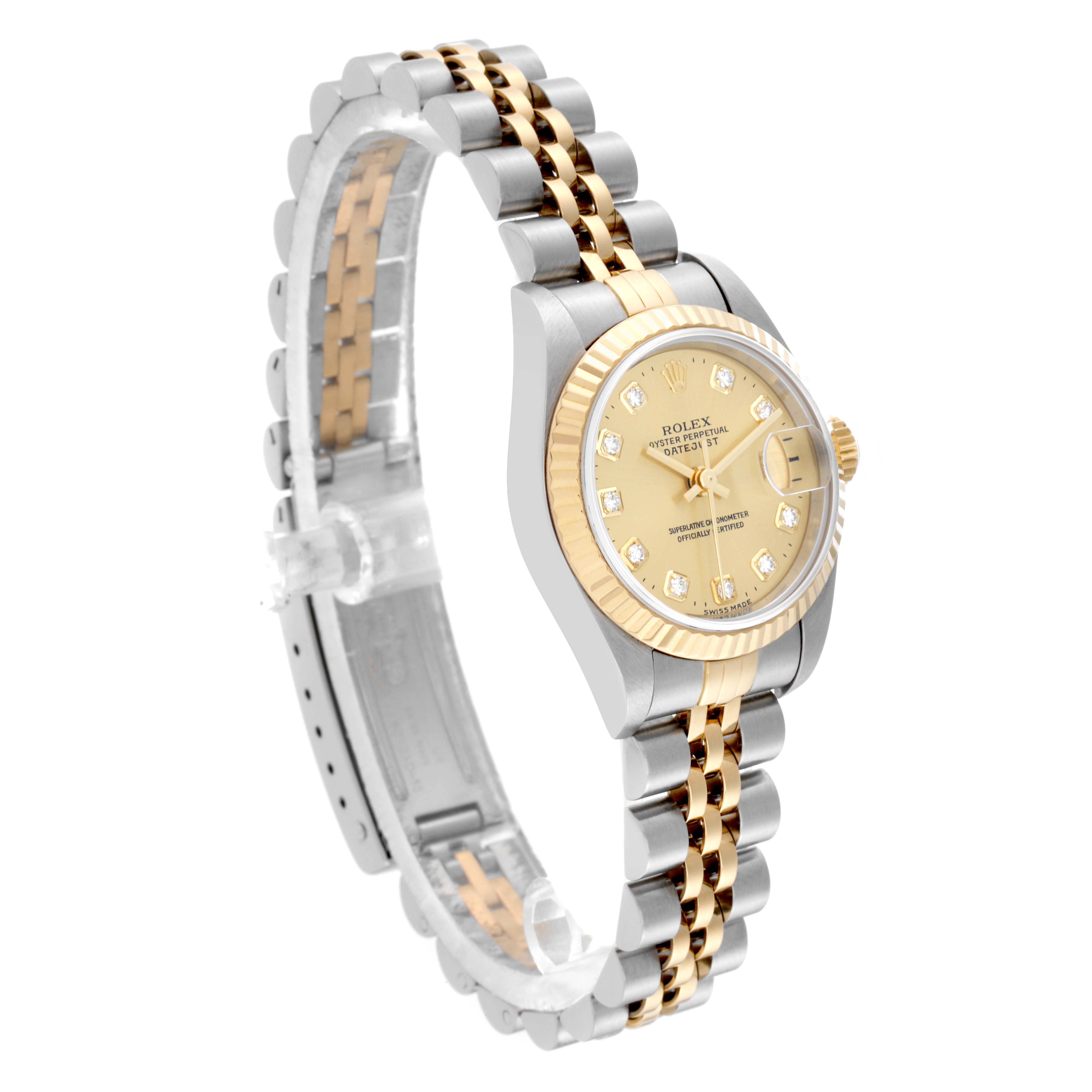 The image shows a Rolex Datejust 69173 Women's Steel and Gold (two tone) Champagne Dial 69173 Women's Steel and Gold (two tone) Champagne Dial watch angled to highlight its two-tone bracelet, gold fluted bezel, and diamond hour markers.