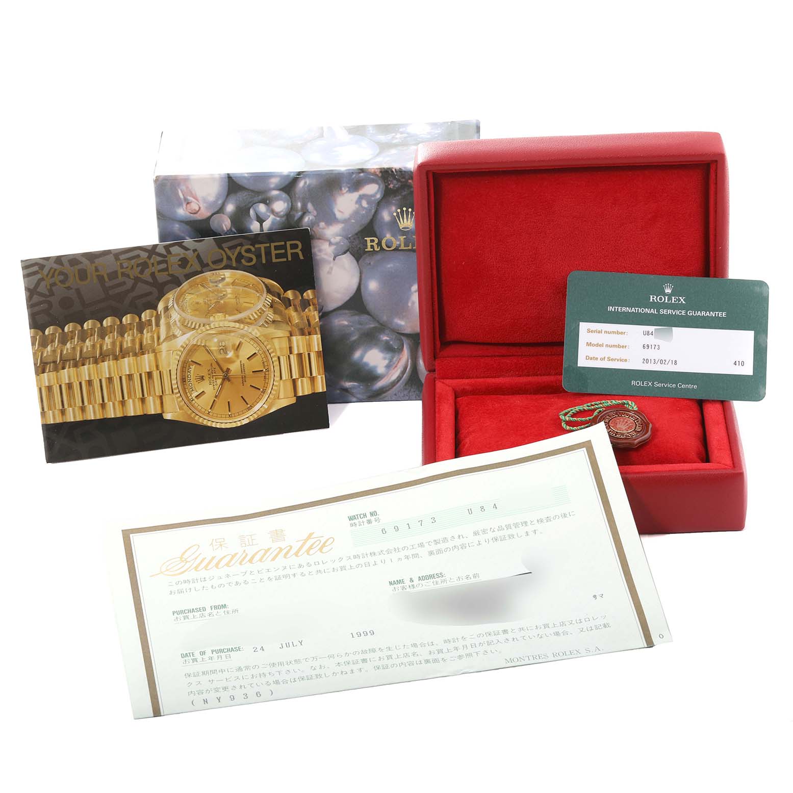 The image shows the Rolex Datejust 69173 Women's Steel and Gold (two tone) Champagne Dial 69173 Women's Steel and Gold (two tone) Champagne Dial packaging, guarantee card, service guarantee card, booklet, and a red watch box.