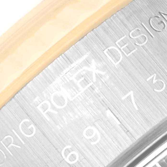 This close-up image shows the engraved text on the metal bezel of a Rolex Datejust 69173 Women's Steel and Gold (two tone) Champagne Dial 69173 Women's Steel and Gold (two tone) Champagne Dial watch.