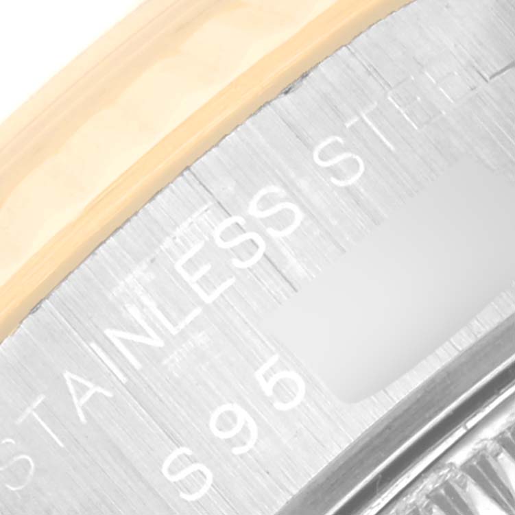 The image shows a close-up of the case back edge of a Rolex Datejust 69173 Women's Steel and Gold (two tone) Champagne Dial 69173 Women's Steel and Gold (two tone) Champagne Dial watch, highlighting the "STAINLESS STEEL" engraving.