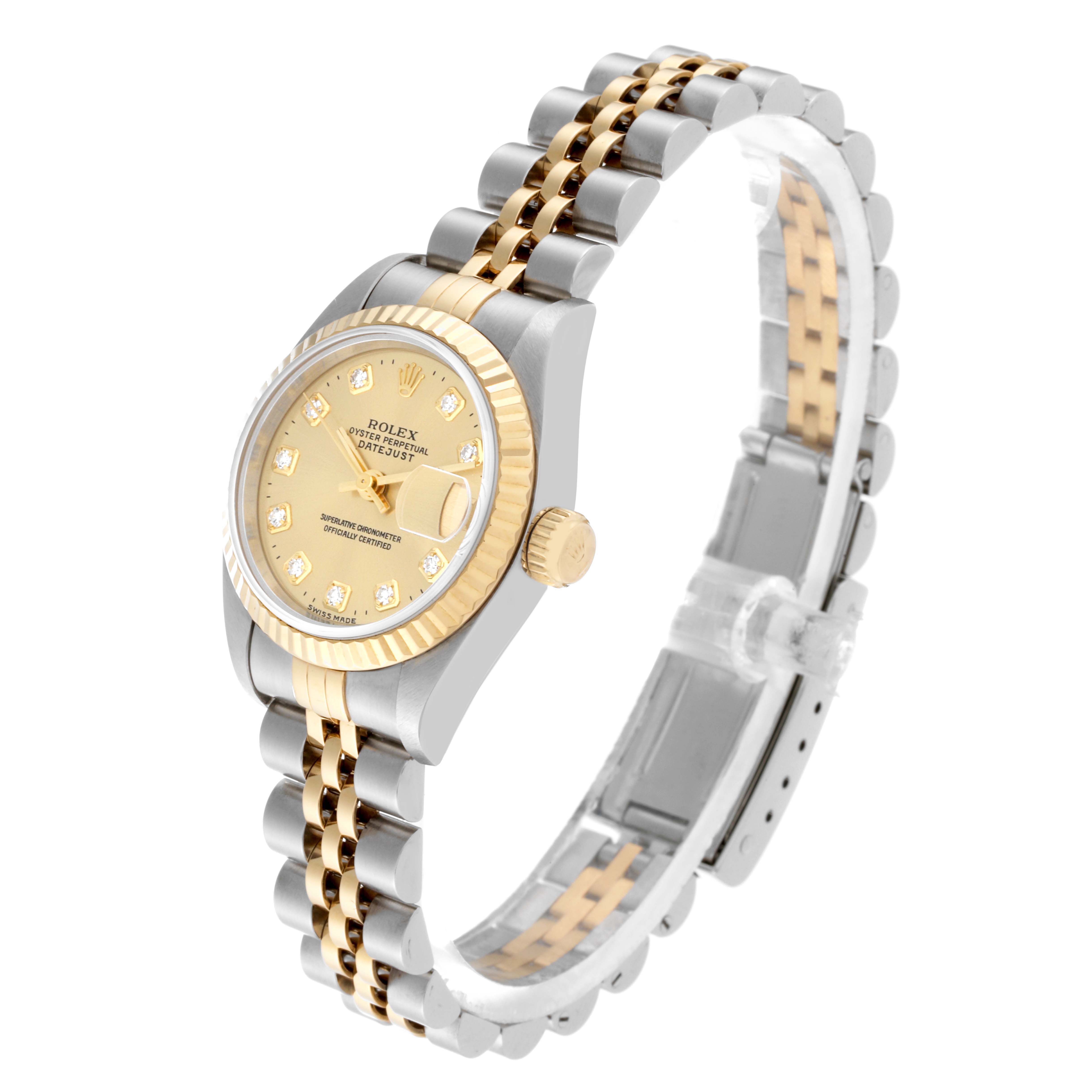 The Rolex Datejust 69173 Women's Steel and Gold (two tone) Champagne Dial 69173 Women's Steel and Gold (two tone) Champagne Dial watch is shown at an angle displaying the face, crown, part of the bracelet, and deployment clasp.