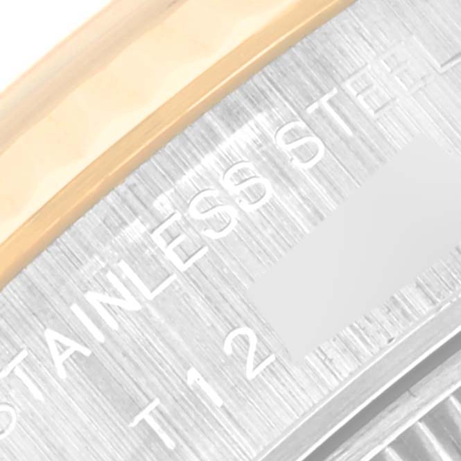 The image shows a close-up angle of the side portion of the Rolex Datejust 69173 Women's Steel and Gold (two tone) Champagne Dial 69173 Women's Steel and Gold (two tone) Champagne Dial watch, highlighting the "STAINLESS STEEL" inscription on the case.