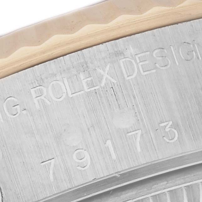 The image shows a close-up of the inner bezel with "Rolex Design" and a model number on the Rolex Datejust 79173 Women
s Steel and Gold (two tone) Mother of Pearl Dial 79173 Women
s Steel and Gold (two tone) Mother of Pearl Dial.
