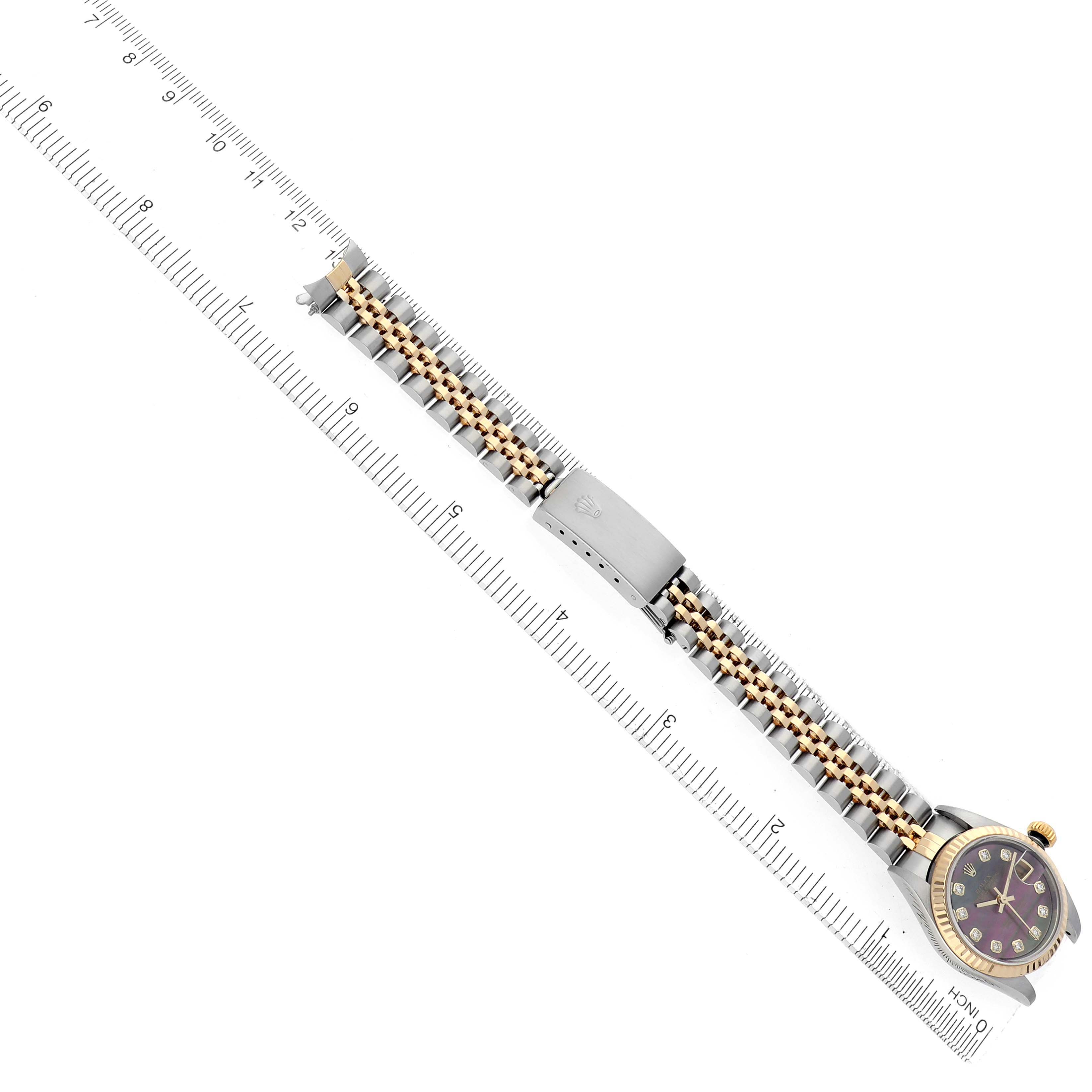 The Rolex Datejust 79173 Women
s Steel and Gold (two tone) Mother of Pearl Dial 79173 Women
s Steel and Gold (two tone) Mother of Pearl Dial watch is shown from an overhead angle, highlighting the bracelet and clasp.