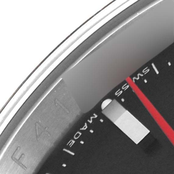 This is a close-up of the bezel and dial of a Turn-o-Graph model by Rolex, showing part of the minute hand and markers.