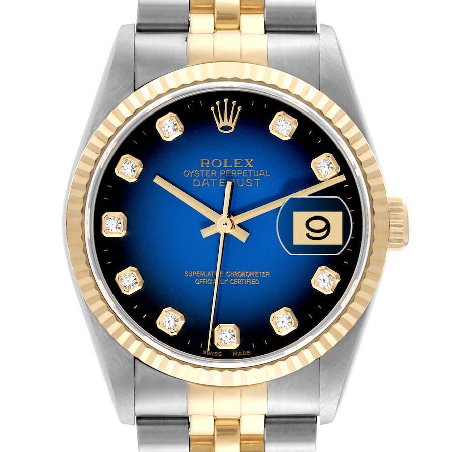 The image shows a front view of the Rolex Datejust watch face, highlighting its blue dial, date window, and two-tone bracelet.