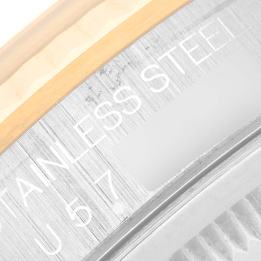 This close-up image of a Rolex Datejust 16233 Men's Steel and Gold (two tone) Blue Dial 16233 Men's Steel and Gold (two tone) Blue Dial watch shows the stainless steel case edge and part of the bezel.