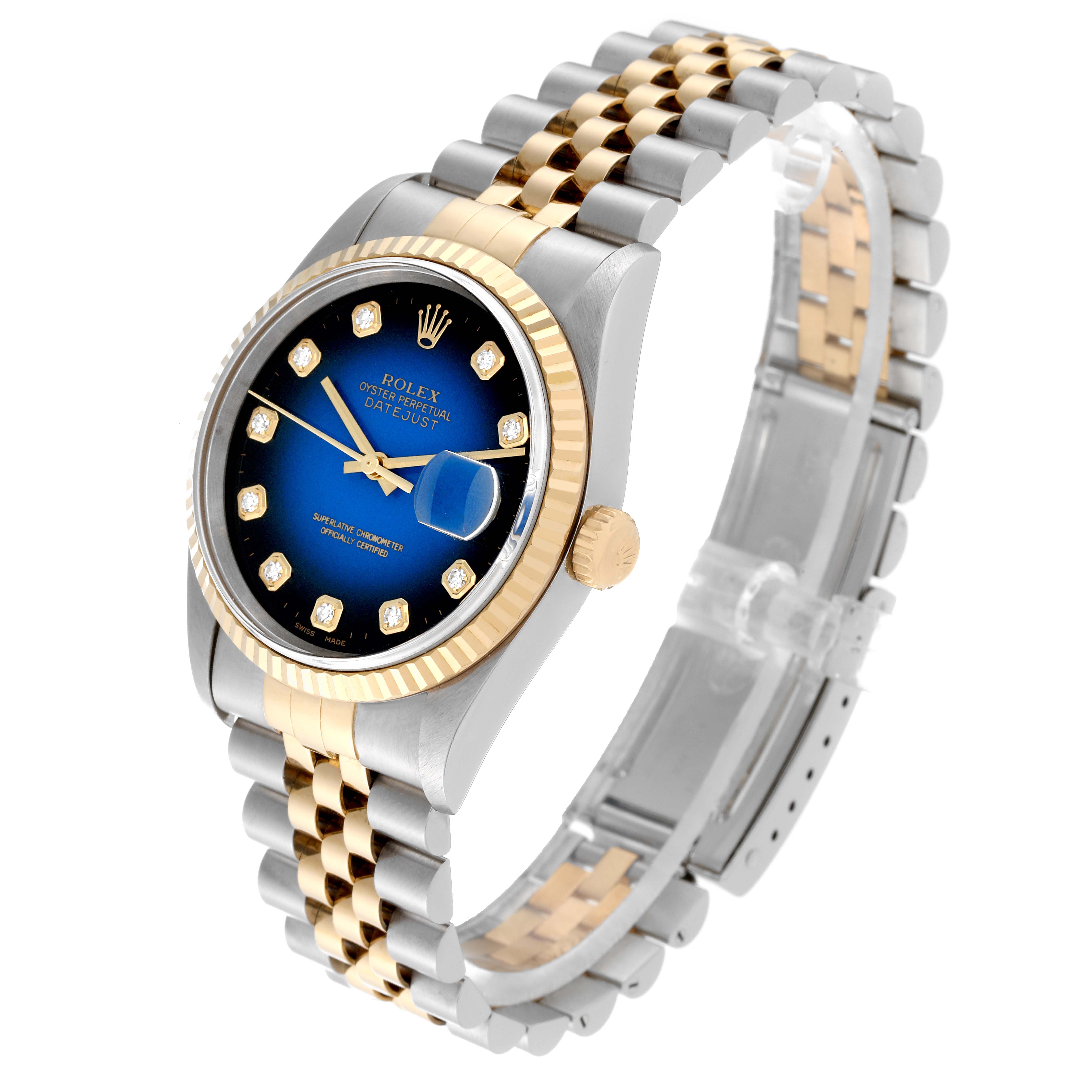 This Rolex Datejust 16233 Men's Steel and Gold (two tone) Blue Dial 16233 Men's Steel and Gold (two tone) Blue Dial watch is shown at a high angle, highlighting its blue dial, gold fluted bezel, and two-tone bracelet.