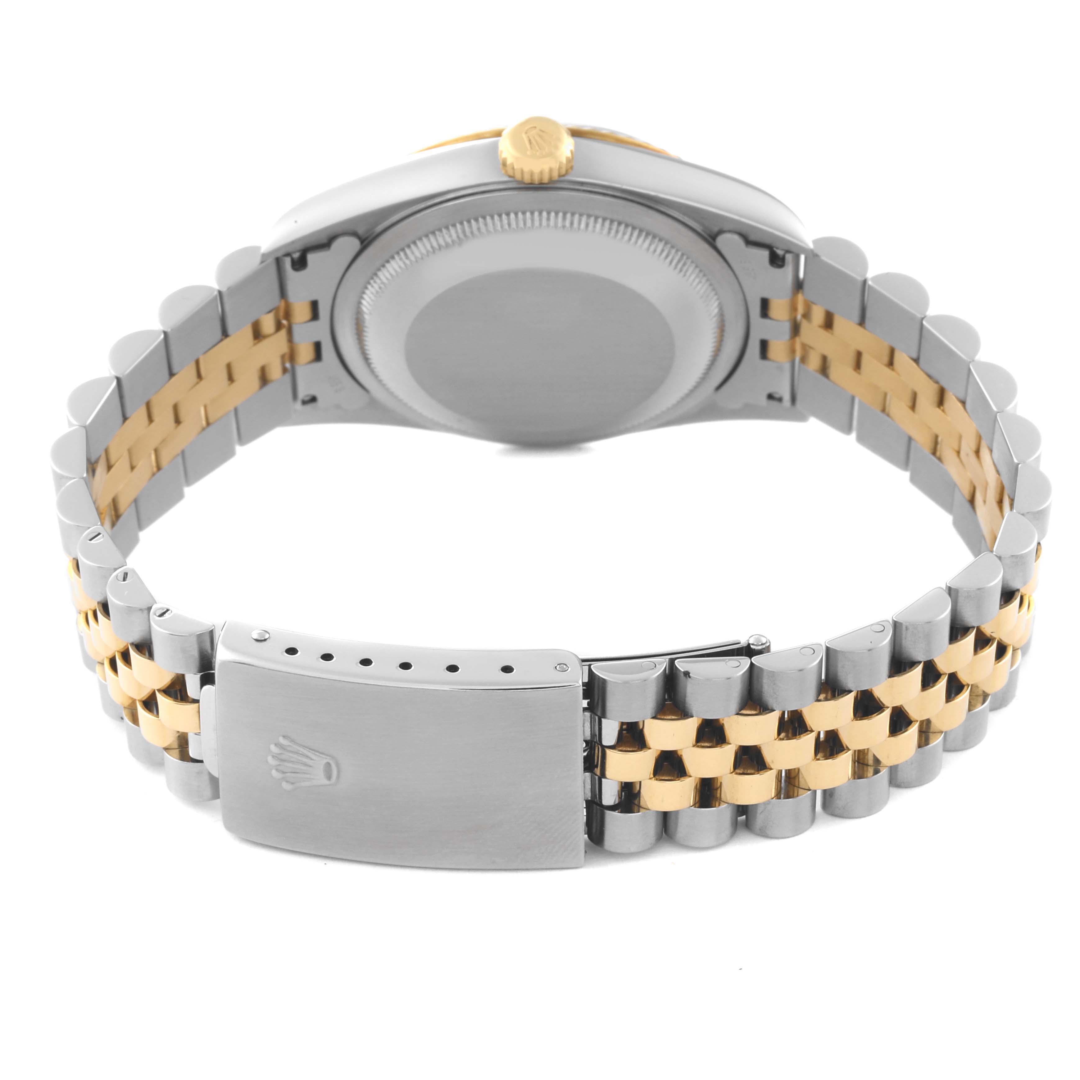 The image shows the back view of a Rolex Datejust 16233 Men's Steel and Gold (two tone) Blue Dial 16233 Men's Steel and Gold (two tone) Blue Dial watch, highlighting the case back and the two-tone bracelet with the clasp.