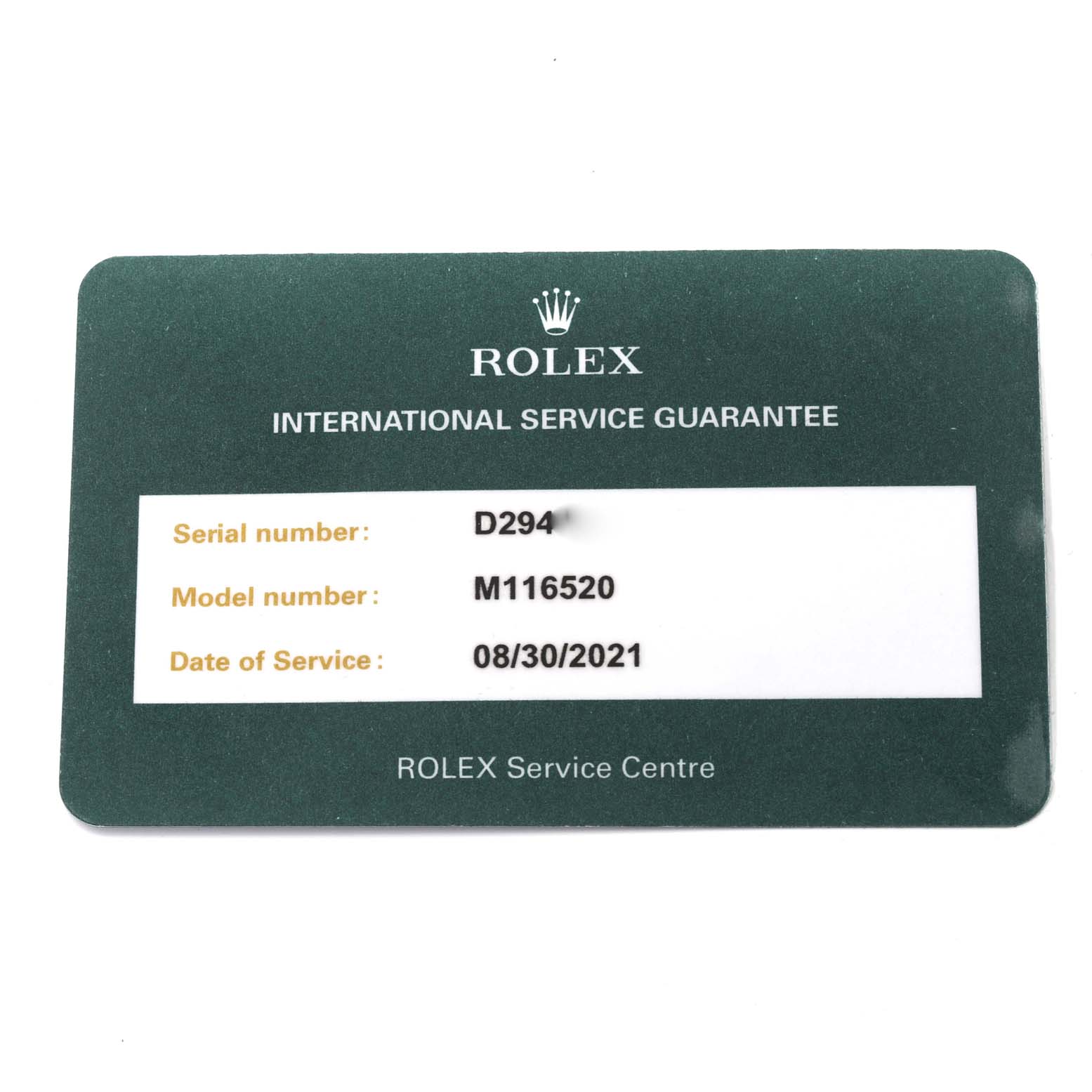 The image shows an International Service Guarantee card for a Rolex Daytona 116520 Men's Stainless Steel Black Dial 116520 Men's Stainless Steel Black Dial model M116520.