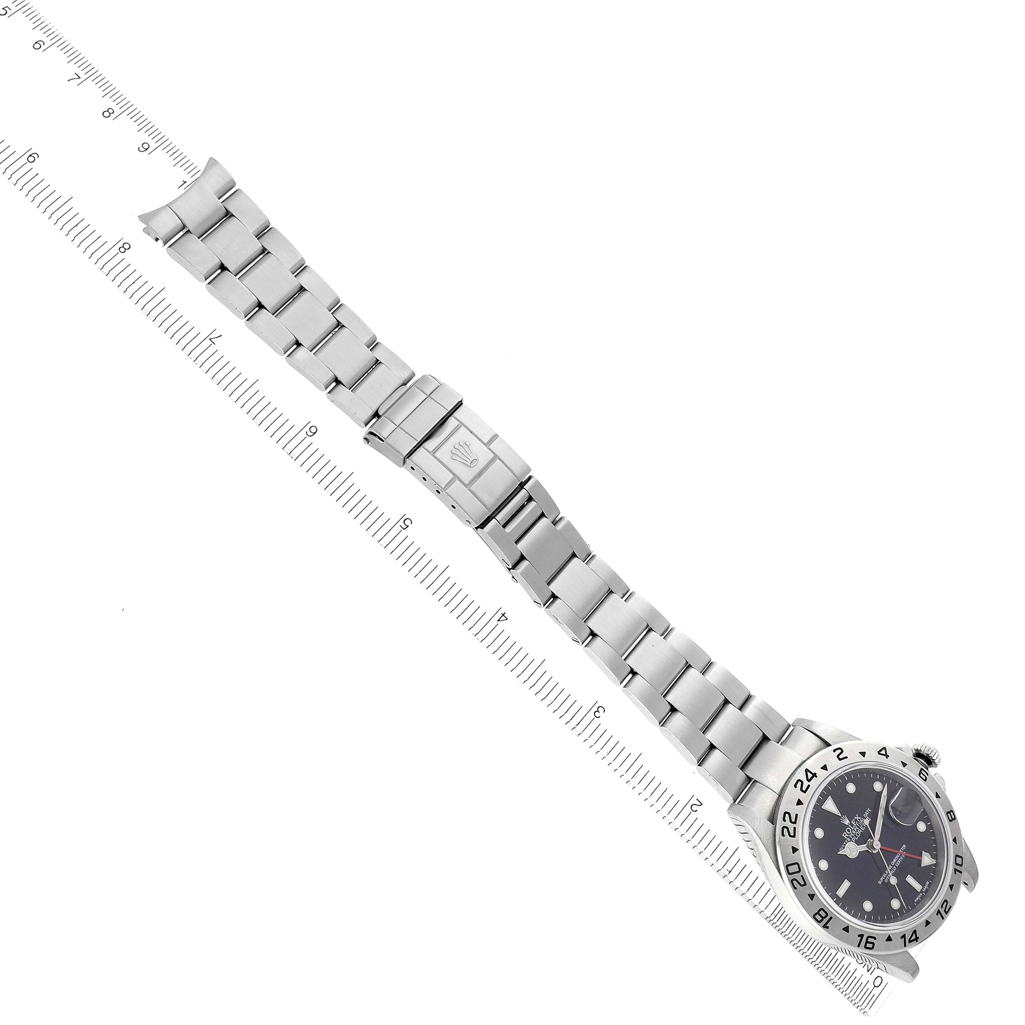 The image shows a Rolex Explorer 16570 Men
s Stainless Steel Black Dial 16570 Men
s Stainless Steel Black Dial watch at an angled top view, highlighting the dial, bezel, bracelet, and clasp.