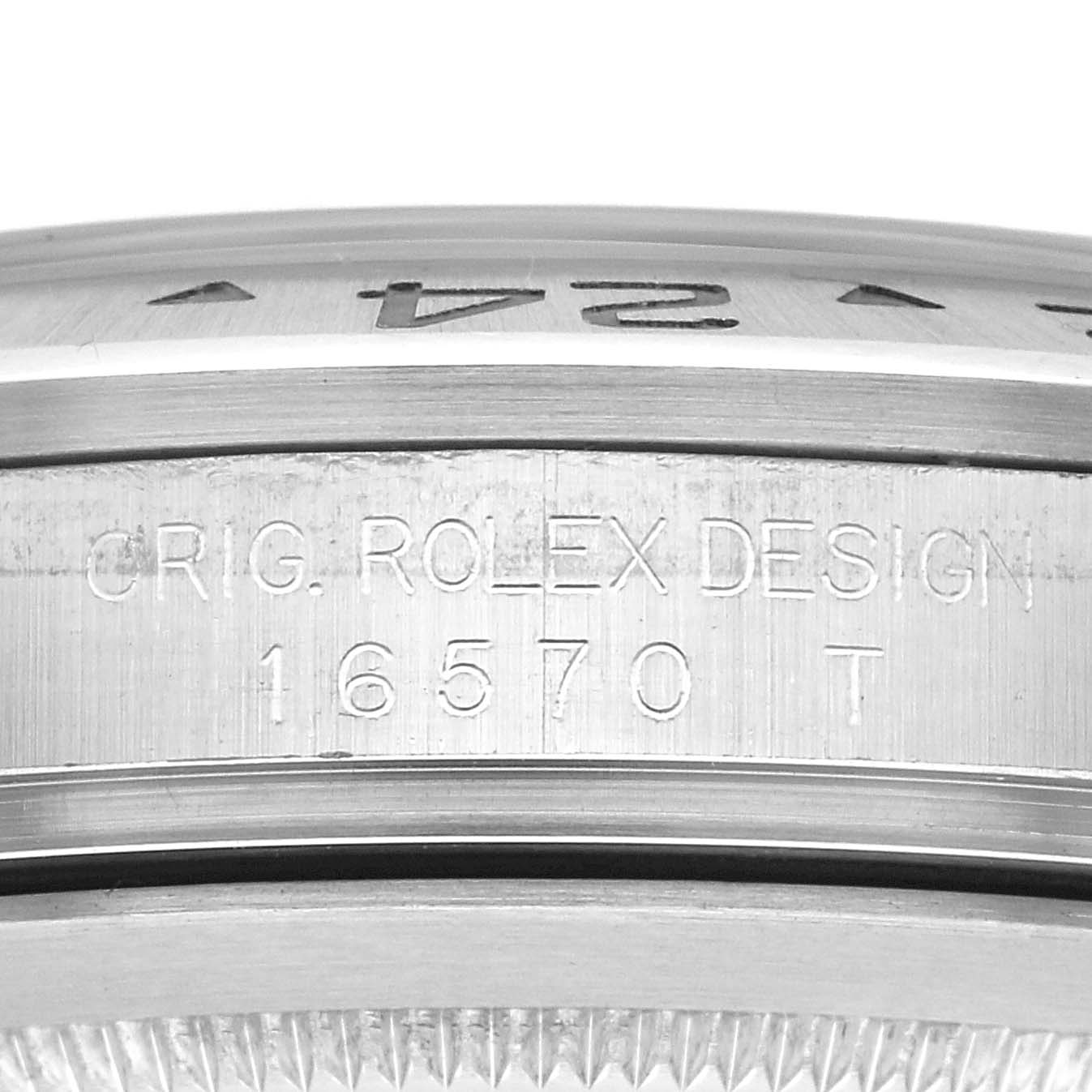 The image shows a close-up of the Rolex Explorer 16570 Men
s Stainless Steel Black Dial 16570 Men
s Stainless Steel Black Dial
s case side, highlighting engraved details and part of the bezel.