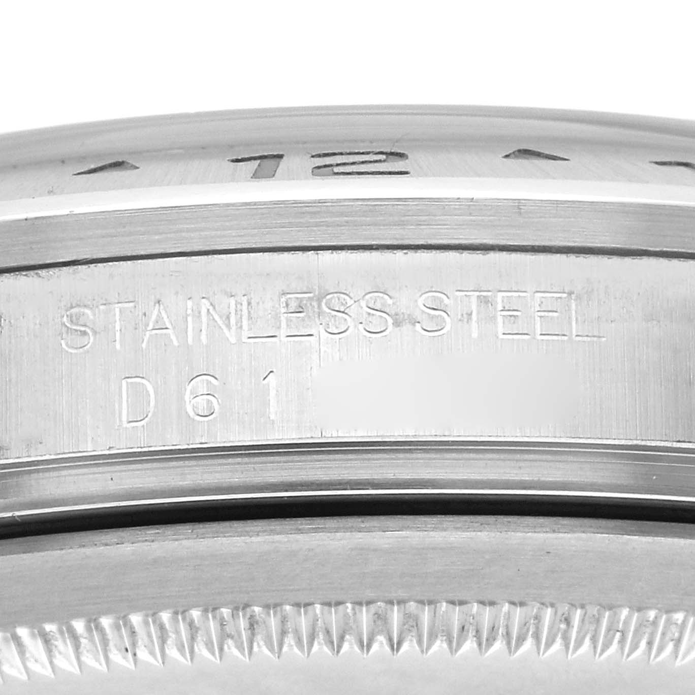 The image shows a close-up of the edge and engraving on the bezel of a Rolex Explorer 16570 Men
s Stainless Steel Black Dial 16570 Men
s Stainless Steel Black Dial watch.