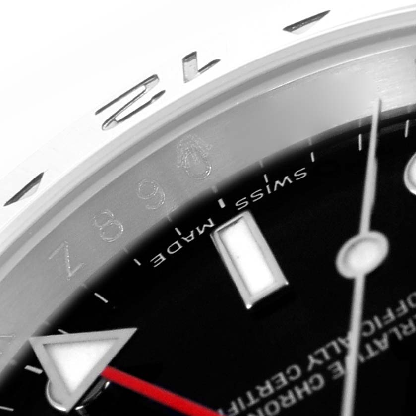 The image shows a close-up of the dial and bezel of the Rolex Explorer 16570 Men
s Stainless Steel Black Dial 16570 Men
s Stainless Steel Black Dial, focusing on the indices and a partial view of the hands.