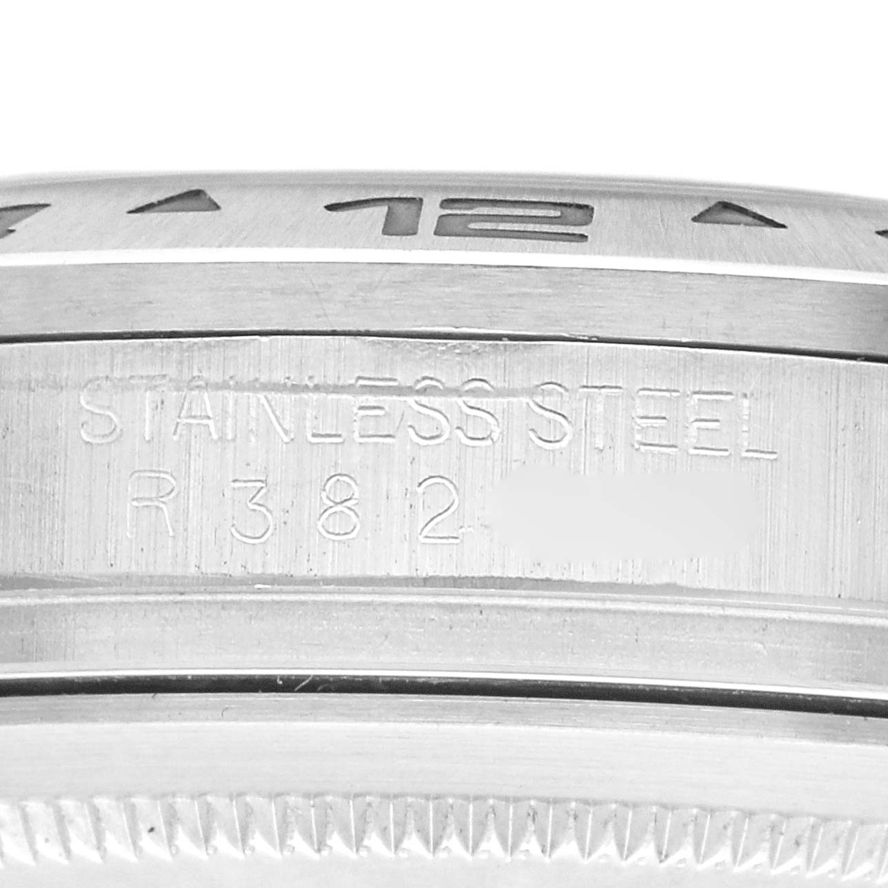 The image shows a close-up of the stainless steel side and outer bezel of a Rolex Explorer 16550 Men
s Stainless Steel White Dial 16550 Men
s Stainless Steel White Dial watch.