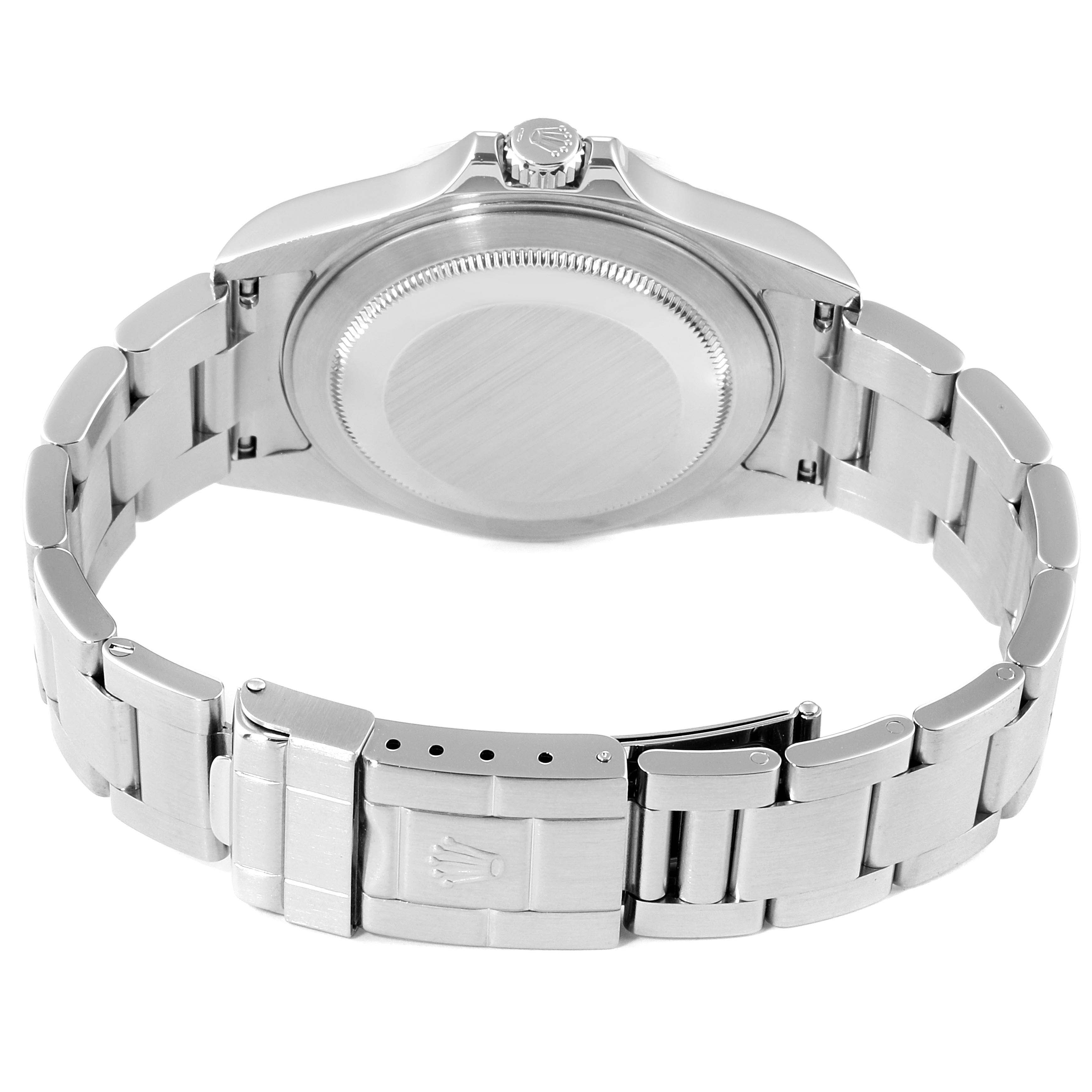 The image shows the backside of a Rolex Explorer 16570 Men
s Stainless Steel White Dial 16570 Men
s Stainless Steel White Dial watch, highlighting its clasp, bracelet, and case back.