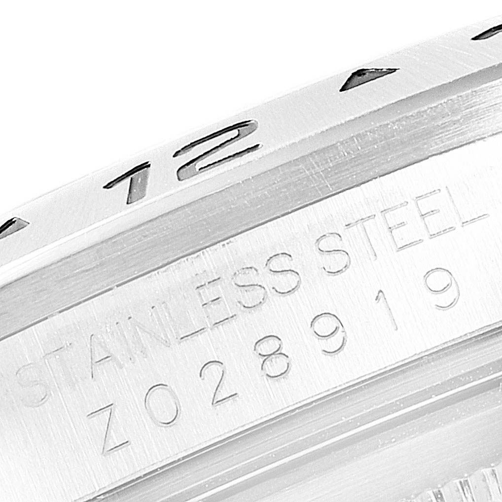 This close-up image shows the side of the stainless steel case and bezel of a Rolex Explorer 16570 Men
s Stainless Steel White Dial 16570 Men
s Stainless Steel White Dial watch.