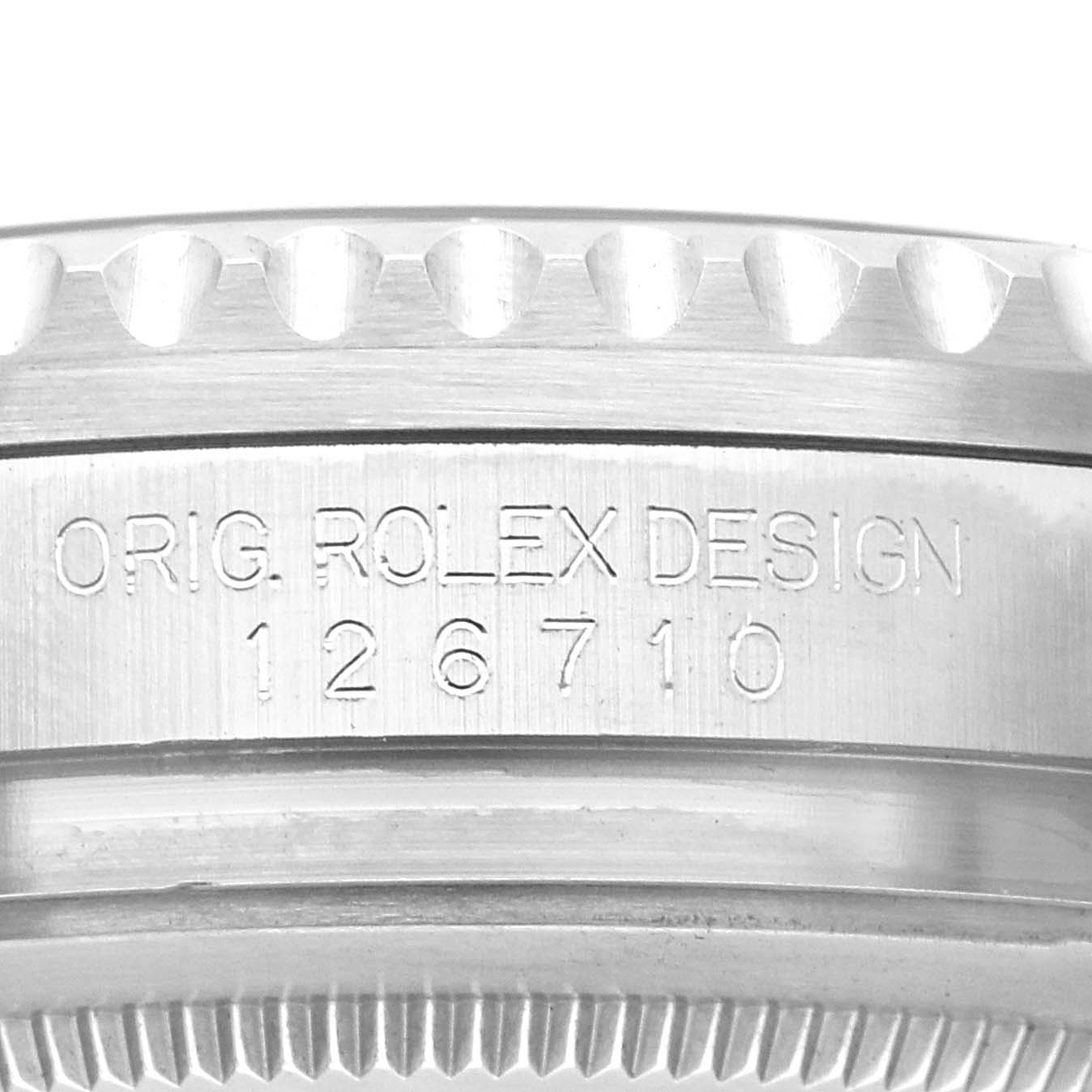 The image shows the side of a Rolex GMT-Master 126710 Men
s Stainless Steel Black Dial 126710 Men
s Stainless Steel Black Dial, featuring the model number "126710" and "Orig. Rolex Design" engraving.