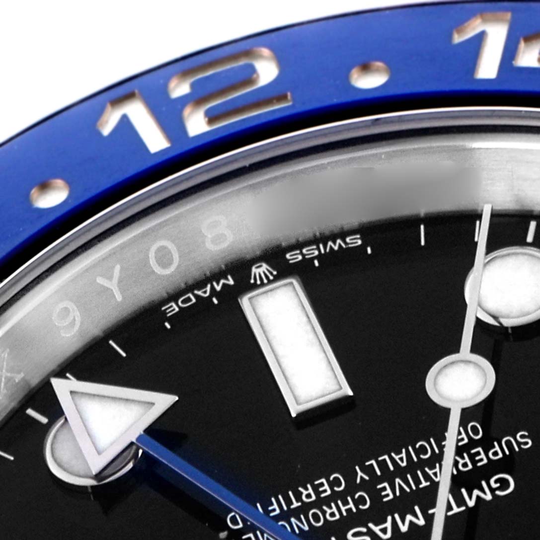 The image shows a close-up of the Rolex GMT-Master 126710 Men
s Stainless Steel Black Dial 126710 Men
s Stainless Steel Black Dial
s bezel and dial with part of the watch face and indices.
