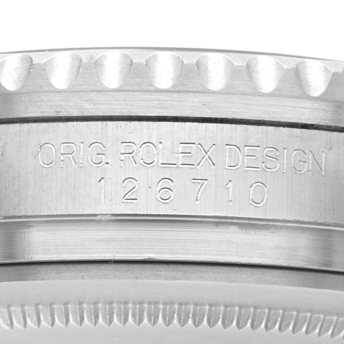 The image shows a close-up of the side of a Rolex GMT-Master 126710 Men
s Stainless Steel Black Dial 126710 Men
s Stainless Steel Black Dial, highlighting the engraved reference number.