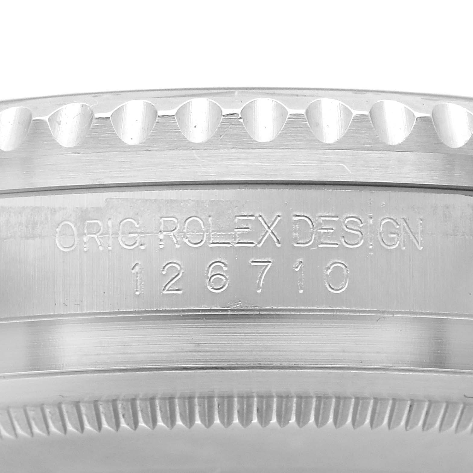 The image shows the side of the bezel and case of a Rolex GMT-Master 126710 Men
s Stainless Steel Black Dial 126710 Men
s Stainless Steel Black Dial, highlighting the engraved model number.