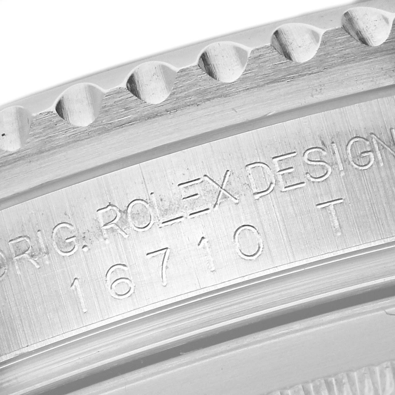 This image shows a close-up of the case side of a Rolex GMT-Master 16710 Men
s Stainless Steel Black Dial 16710 Men
s Stainless Steel Black Dial model, focusing on the bezel edge and engravings.