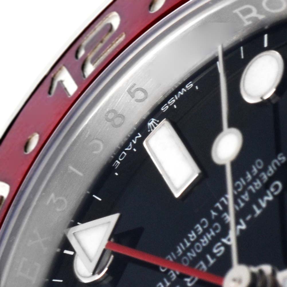 The image shows a close-up of the Rolex GMT-Master 126710BLRO Men
s Stainless Steel Black Dial 126710BLRO Men
s Stainless Steel Black Dial watch face, bezel, and hour markers, highlighting the triangle hand and numbers.