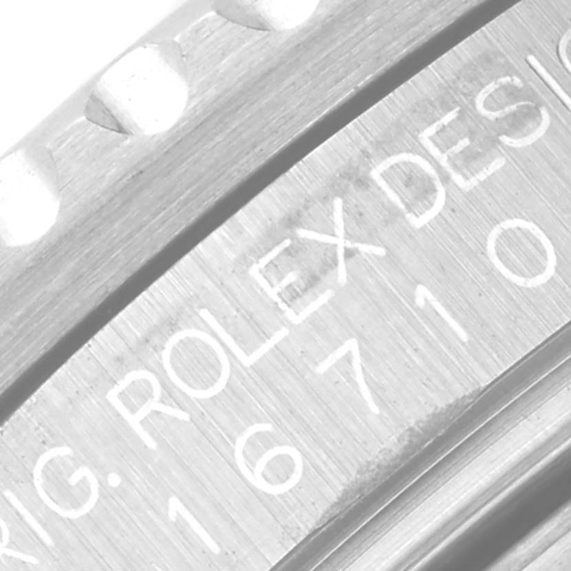 The image shows a close-up view of the case side of a Rolex GMT-Master 16710 Men's Stainless Steel Black Dial 16710 Men's Stainless Steel Black Dial, highlighting the engraved serial and model numbers.
