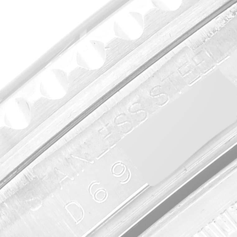 Close-up of the case side of a Rolex GMT-Master 16710 Men's Stainless Steel Black Dial 16710 Men's Stainless Steel Black Dial, showing the engraving and part of the bezel.