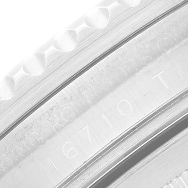 The close-up image shows the engraved model number on the inner bezel of the Rolex GMT-Master 16710 Men's Stainless Steel Black Dial 16710 Men's Stainless Steel Black Dial watch.