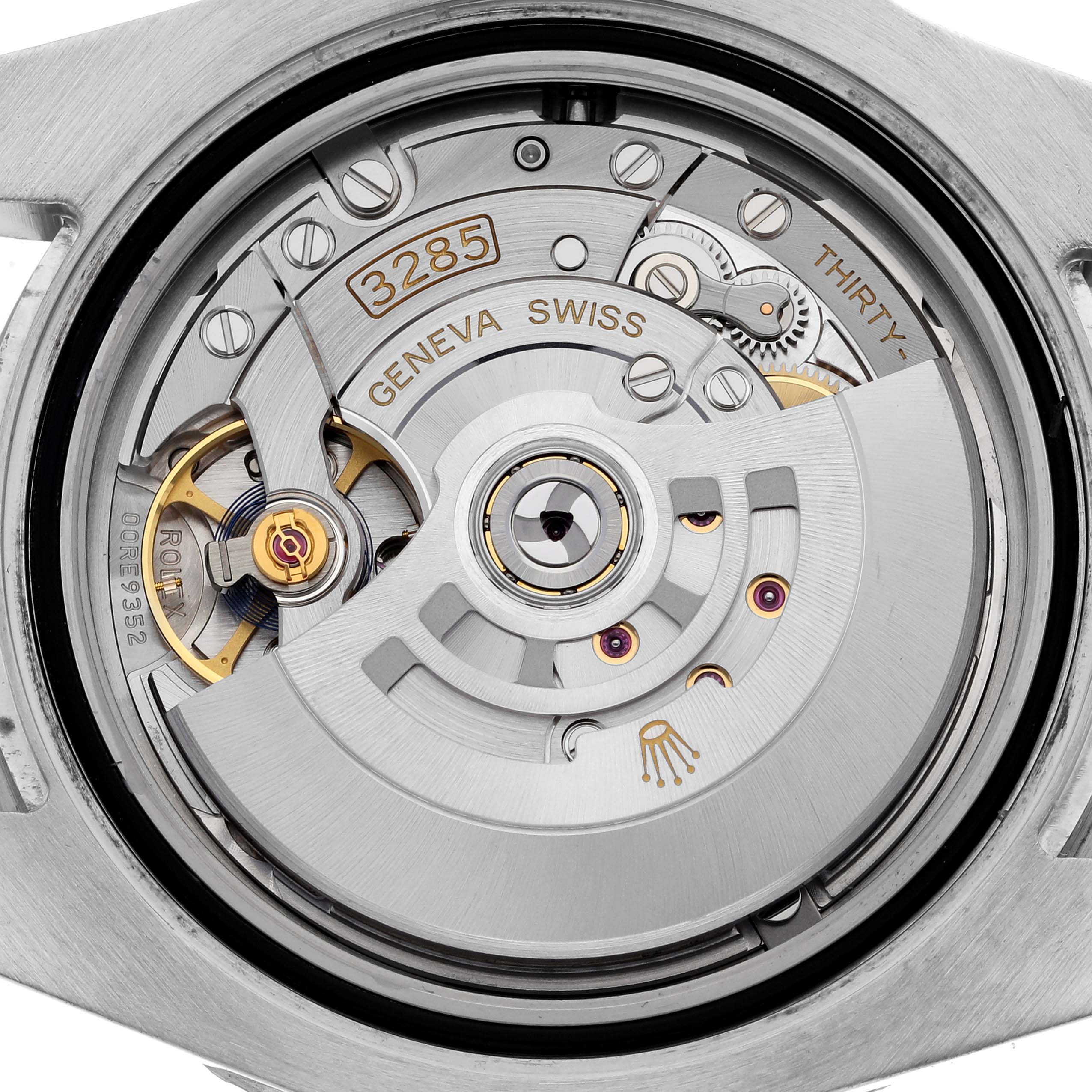 This is an image showing the back of a Rolex GMT-Master 126711CHNR Men's Steel and Gold (two tone) Black Dial 126711CHNR Men's Steel and Gold (two tone) Black Dial watch, revealing its internal movement and mechanism.