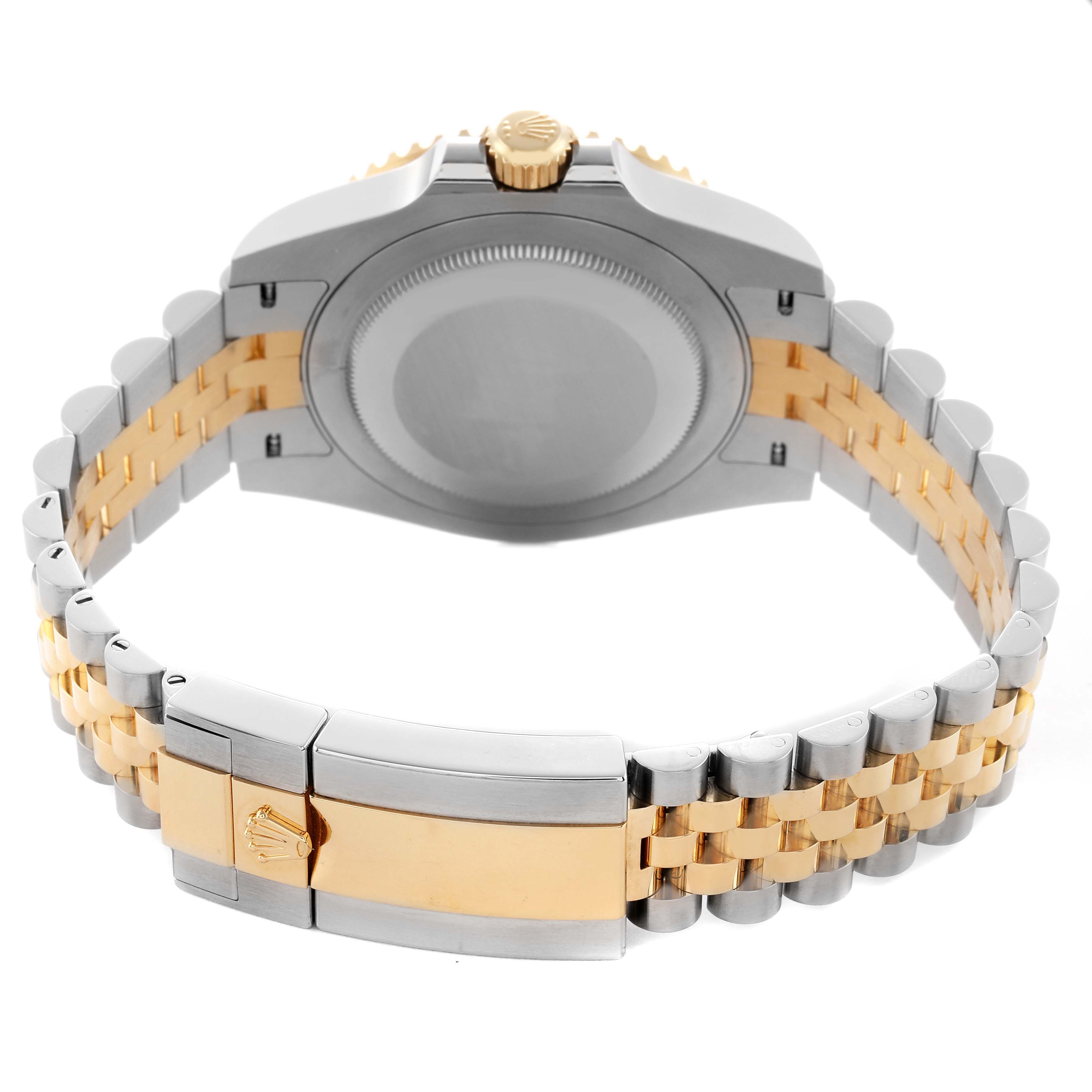 The image shows the back view of a Rolex GMT-Master 126713 Men's Steel and Gold (two tone) Black Dial with focus on its two-tone bracelet and clasp.