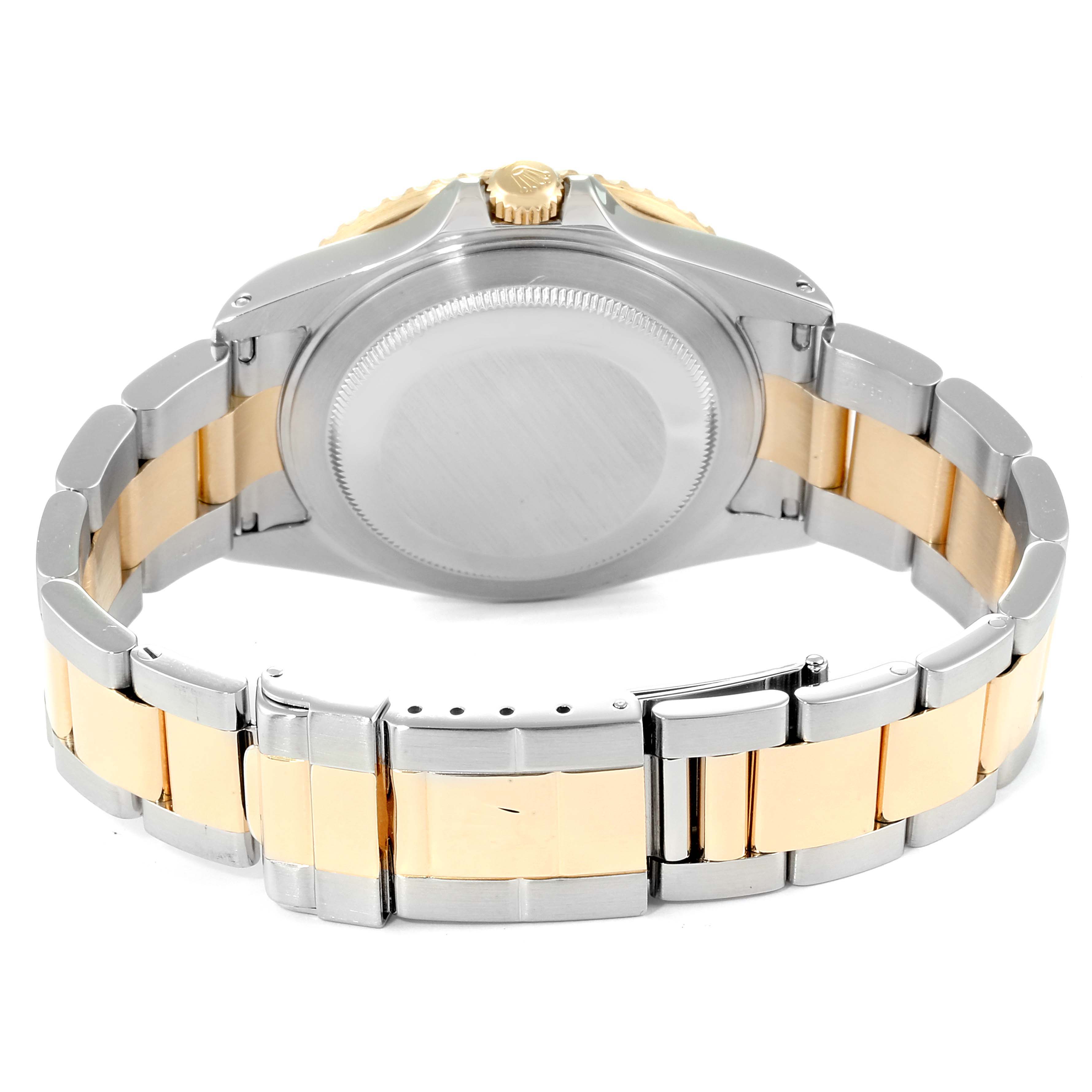 This image displays the back and bracelet of a Rolex GMT-Master 16713 Men
s Steel and Gold (two tone) Black Dial 16713 Men
s Steel and Gold (two tone) Black Dial watch from a rear angle.