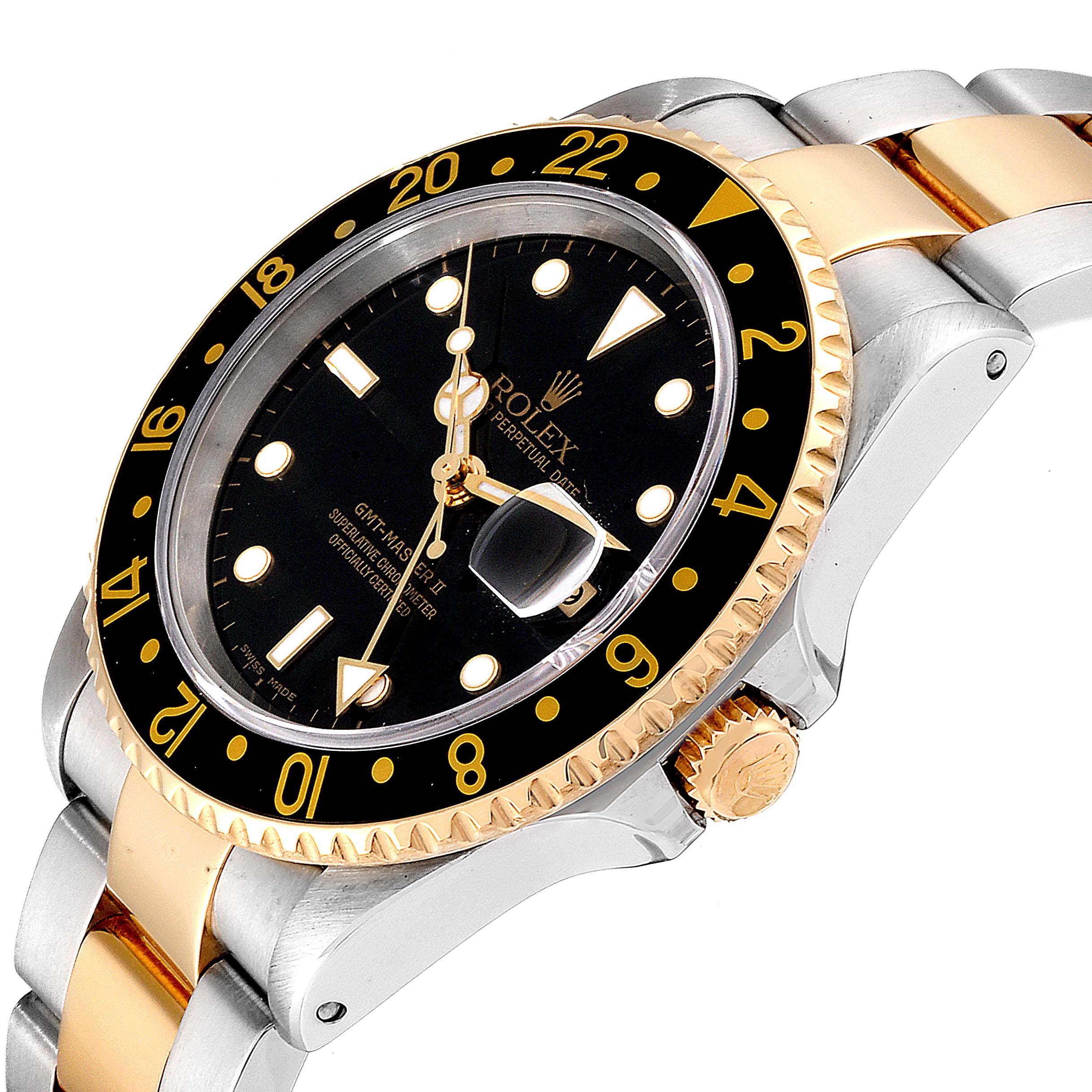 The image shows a close-up angle of a Rolex GMT-Master 16713 Men
s Steel and Gold (two tone) Black Dial 16713 Men
s Steel and Gold (two tone) Black Dial watch, highlighting the bezel, dial, crown, and part of the bracelet.