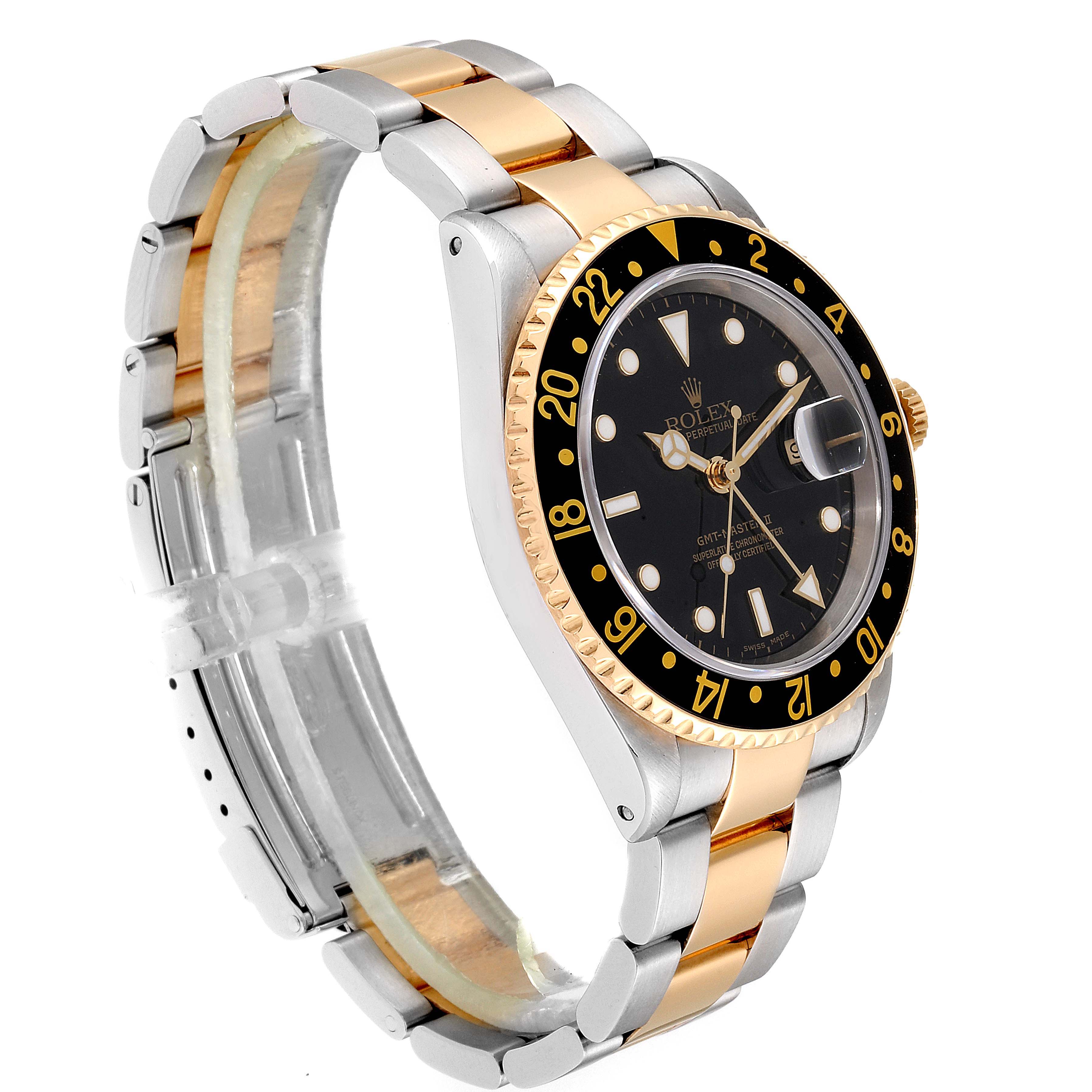 The image shows a side view of the Rolex GMT-Master 16713 Men
s Steel and Gold (two tone) Black Dial 16713 Men
s Steel and Gold (two tone) Black Dial watch, highlighting its two-tone bracelet and black bezel.