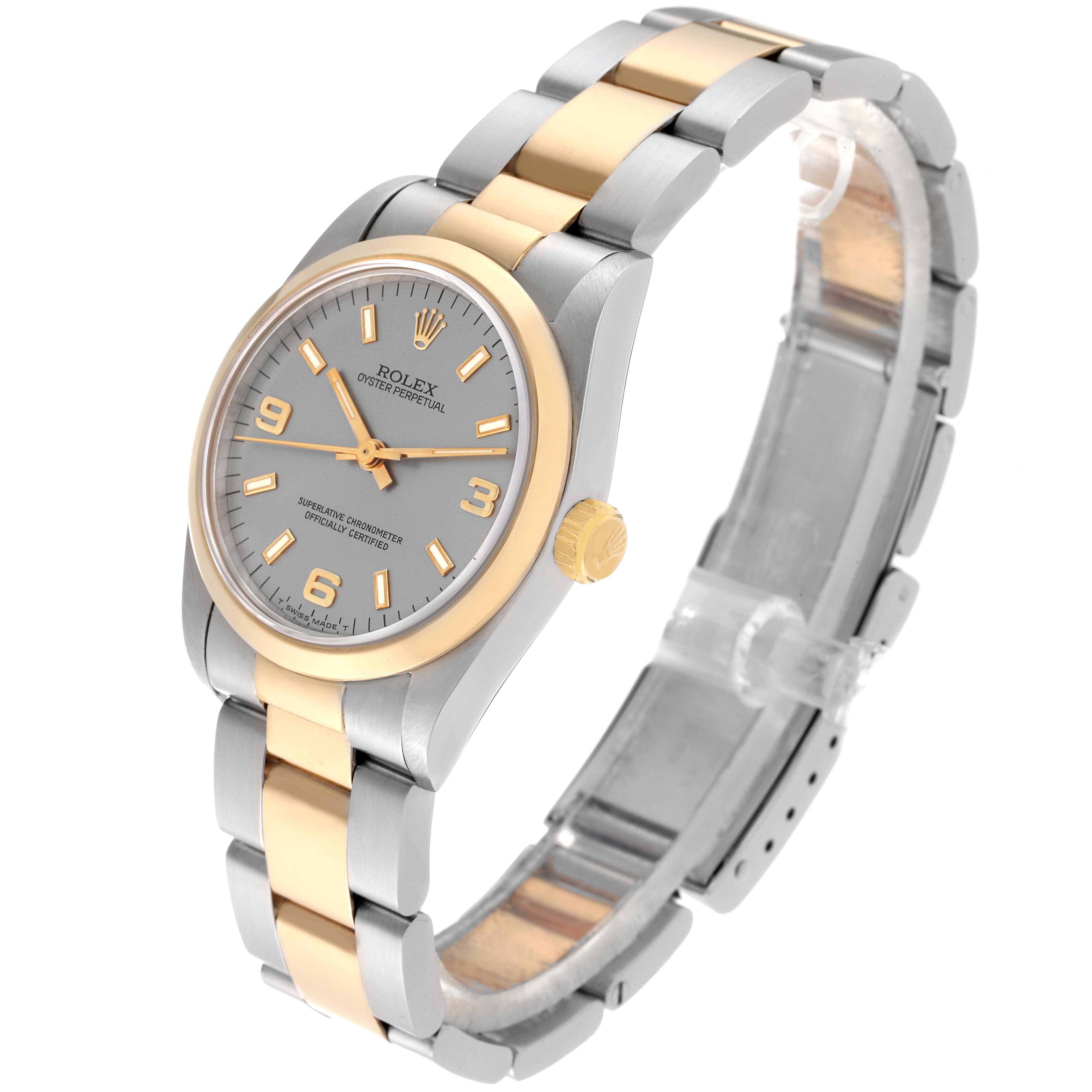 This image shows a Rolex Mid-Size 67483 Women's Steel and Gold (two tone) Silver Dial 67483 Women's Steel and Gold (two tone) Silver Dial Oyster Perpetual watch at a slightly tilted side angle highlighting the bezel, dial, and bracelet.