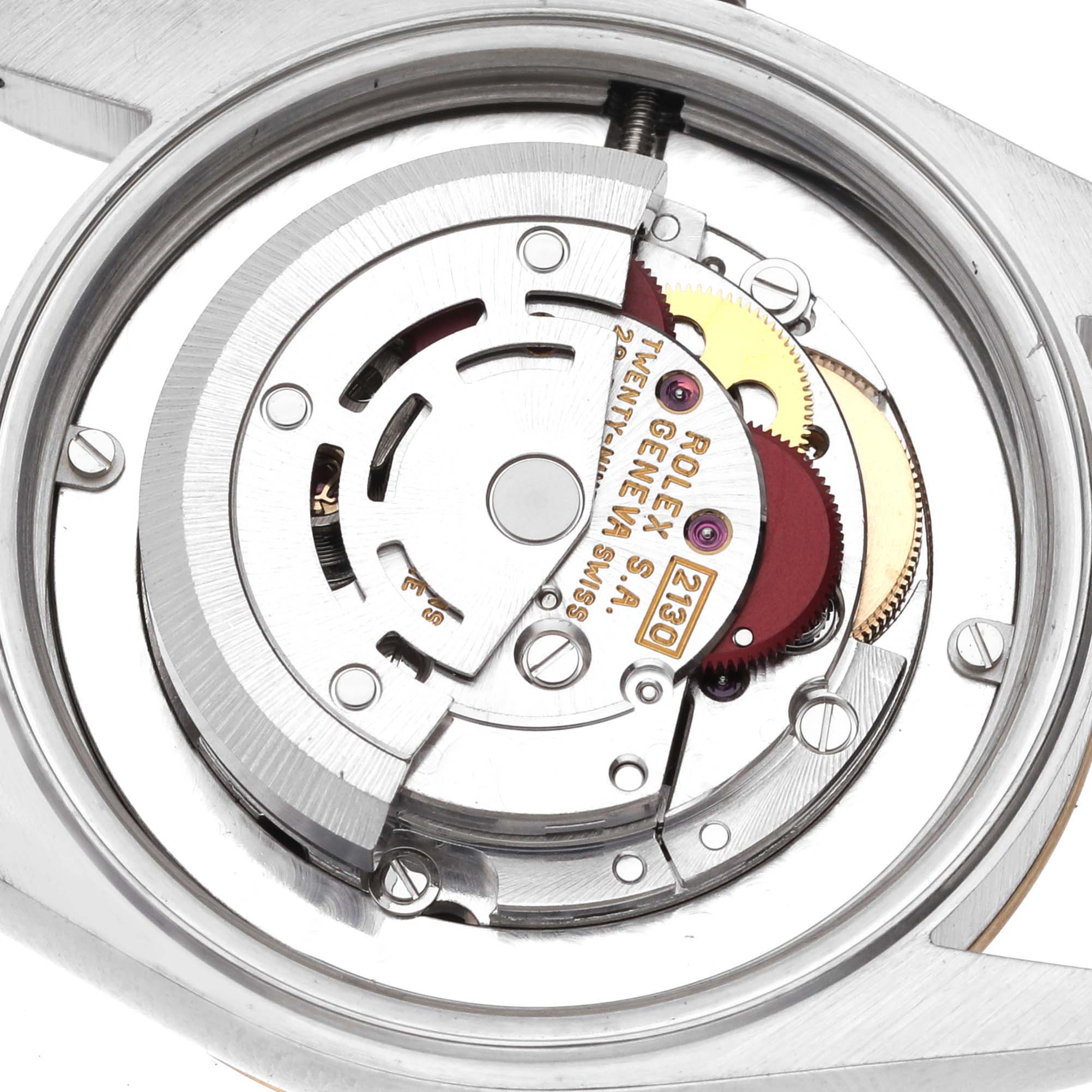 This image shows the internal mechanical movement of a Mid-Size Rolex watch.