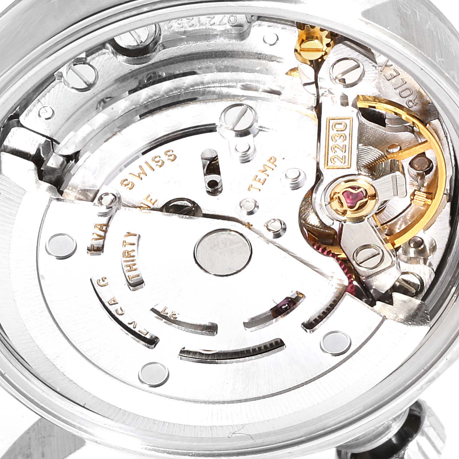 This image shows the inner mechanism of a Rolex Oyster Perpetual 76080 Women's Stainless Steel Pink Dial 76080 Women's Stainless Steel Pink Dial watch, highlighting the movement and intricate parts.