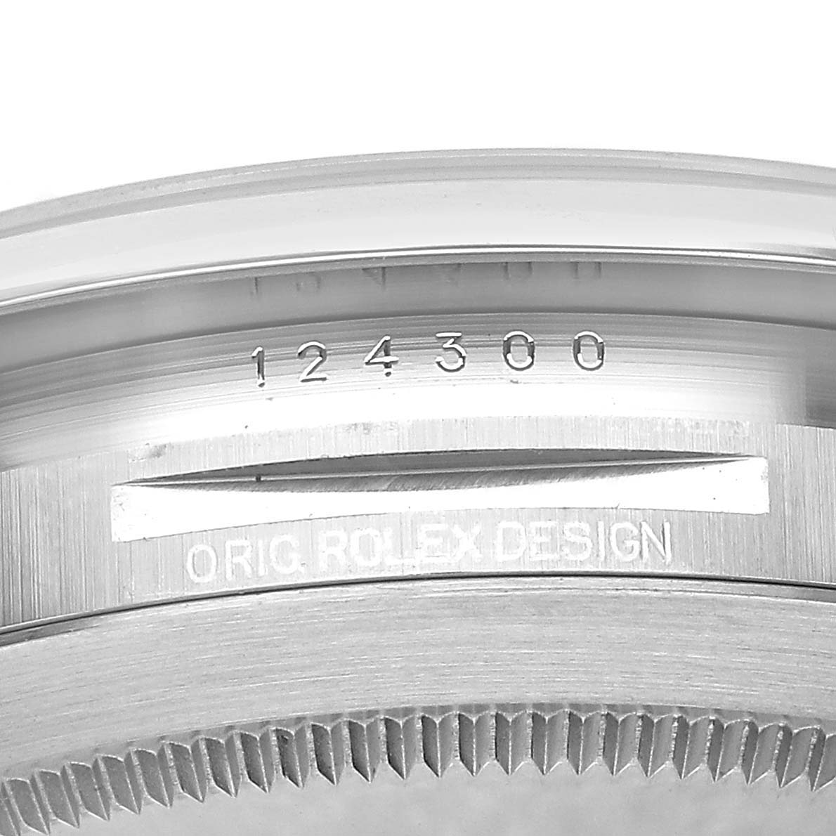 The image shows the side of a Rolex Oyster Perpetual M124300-0002 Mens Stainless Steel Black Dial model case with visible serial and model numbers.